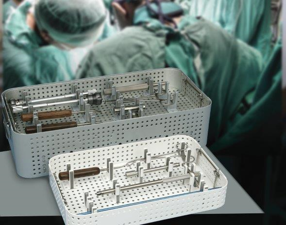 Doctors perform surgery while sterilization trays sit in the foreground