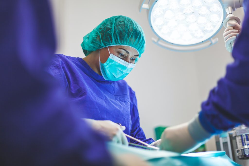 A female doctor performs surgery