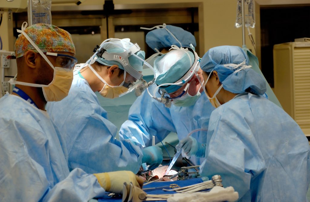 A group of five doctors in the operating room