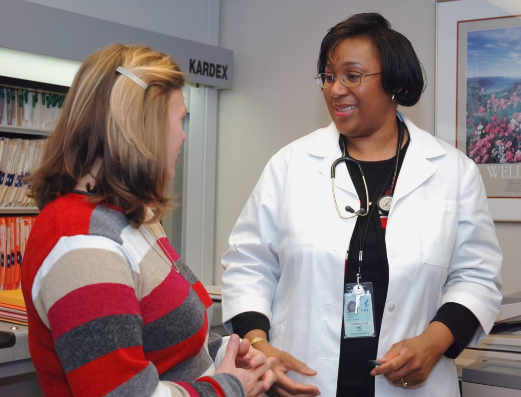 A doctor greets a patient